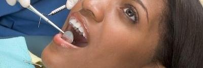 woman in dental chair getting work done