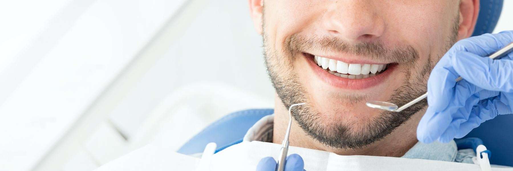 man sitting in a dental chair