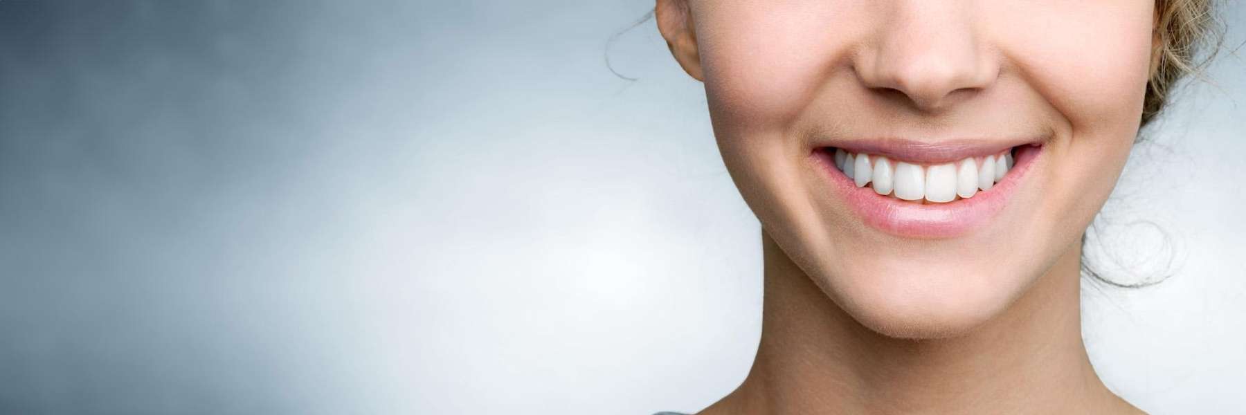 A cheerful woman with a radiant smile, highlighting the effectiveness of dental crowns.