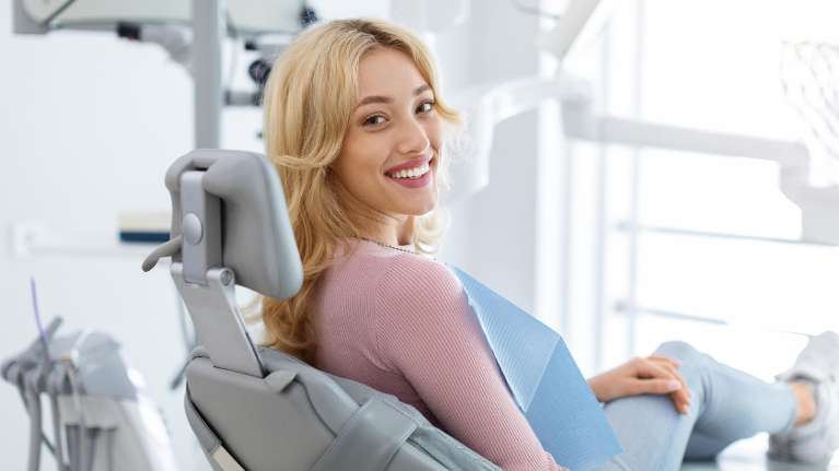 woman sitting in a dental chair | dentist in el dorado