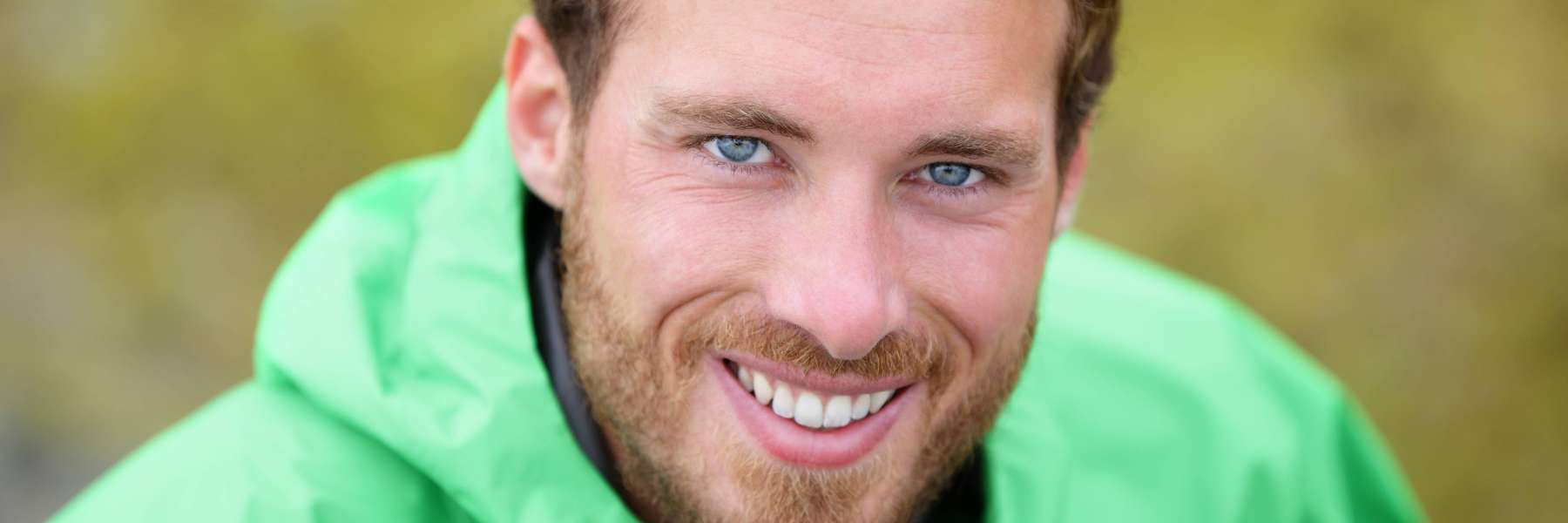 man with blue eyes smiling