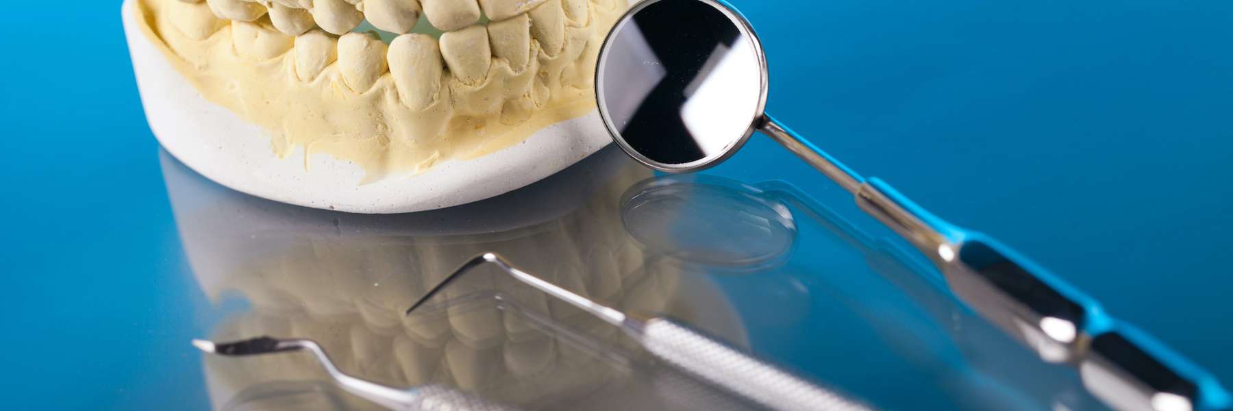 Dental tools and model for tooth pain at a general dentist in El Dorado Hills.