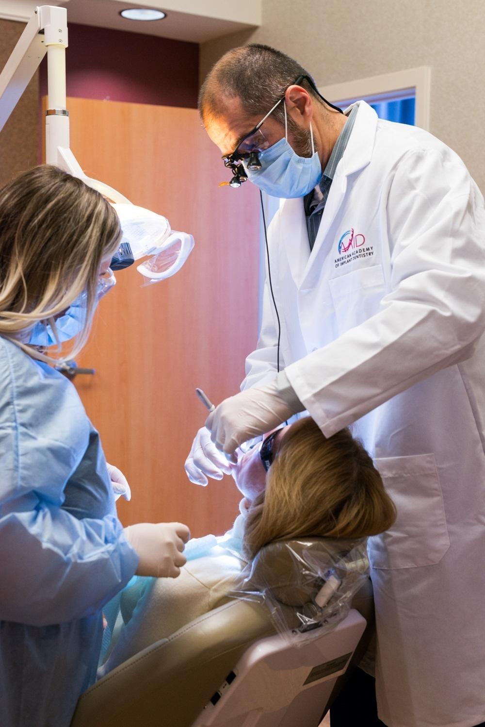 dr. albik working on a patient at el dorado family dental