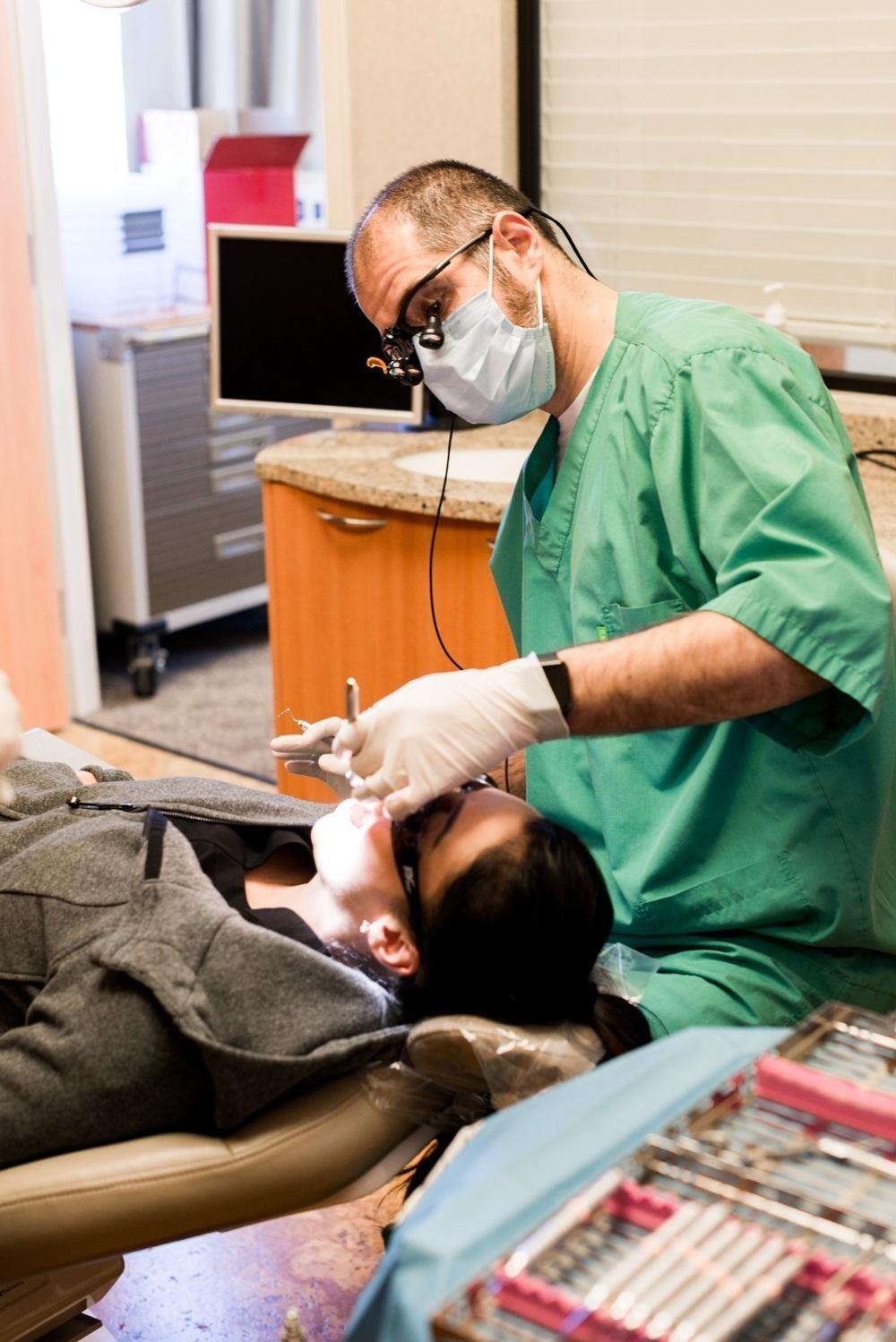 dr. albik treating a patient at el dorado family dental